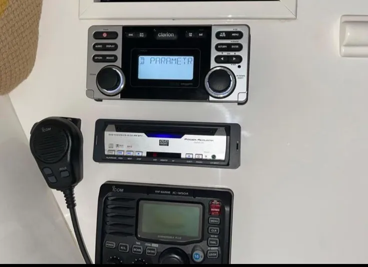  Yacht Photos Pics Boat dashboard with Clarion stereo, Pioneer equalizer, and Icom VHF radio on 2008 Intrepid 370 Cuddy.