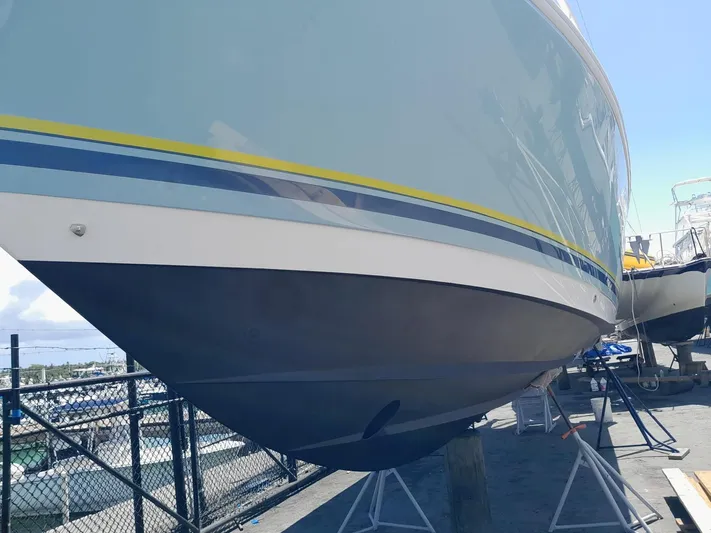  Yacht Photos Pics 2008 Intrepid 370 Cuddy boat on stands, showcasing sleek hull design and vibrant colors.