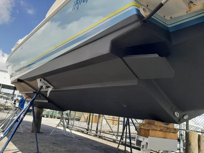  Yacht Photos Pics 2008 Intrepid 370 Cuddy boat on stands, showcasing hull and underside details.