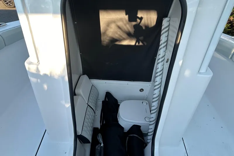  Yacht Photos Pics 2026 Blackfin 242 HB boat interior with seating and storage area.