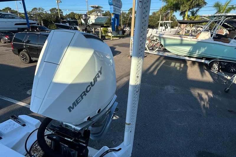  Yacht Photos Pics 2026 Blackfin 242 HB with Mercury engine in a sunny marina setting.