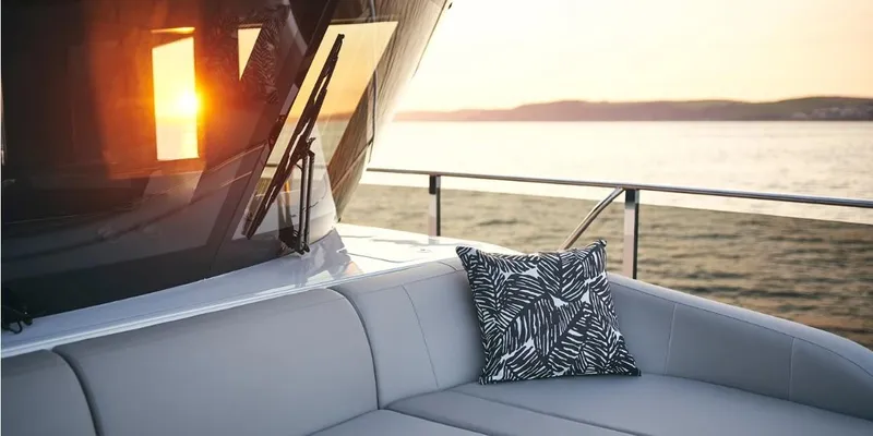  Yacht Photos Pics Luxurious 2026 Princess X95 Vista yacht at sunset, featuring elegant seating and scenic ocean view.