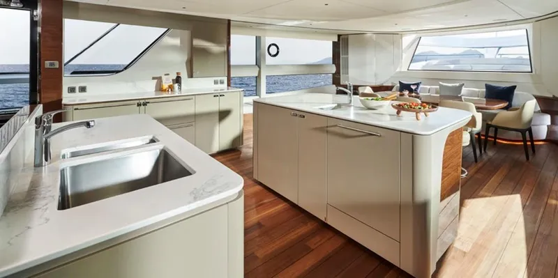  Yacht Photos Pics Luxurious 2026 Princess X95 Vista yacht interior with modern kitchen and ocean view.