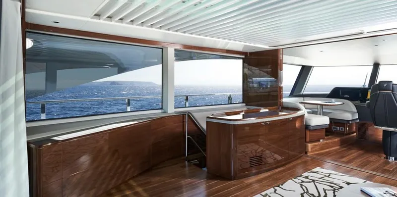  Yacht Photos Pics Luxurious interior of 2026 Princess X95 Vista yacht with ocean view and elegant wood finishes.