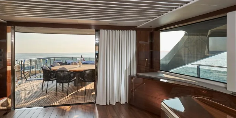 Yacht Photos Pics Luxurious interior of 2026 Princess X95 Vista yacht with ocean view and elegant dining area.