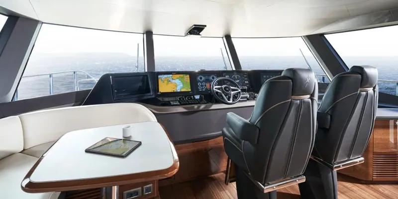  Yacht Photos Pics Luxurious 2026 Princess X95 Vista yacht interior with modern navigation controls and seating.