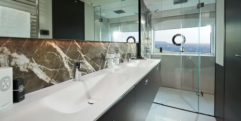  Yacht Photos Pics Luxurious bathroom in 2026 Princess X95 Vista yacht, featuring marble accents and modern fixtures.