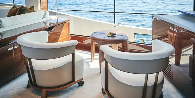  Yacht Photos Pics Luxurious interior of 2026 Princess X95 Vista yacht with elegant seating and ocean view.