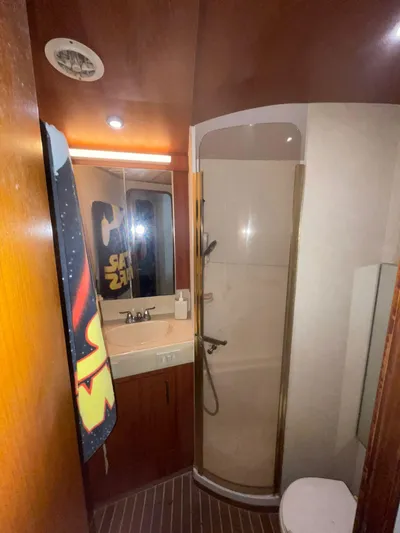 Yacht Photos Pics Bathroom interior of 2000 Ocean Yachts Convertible with shower and sink.