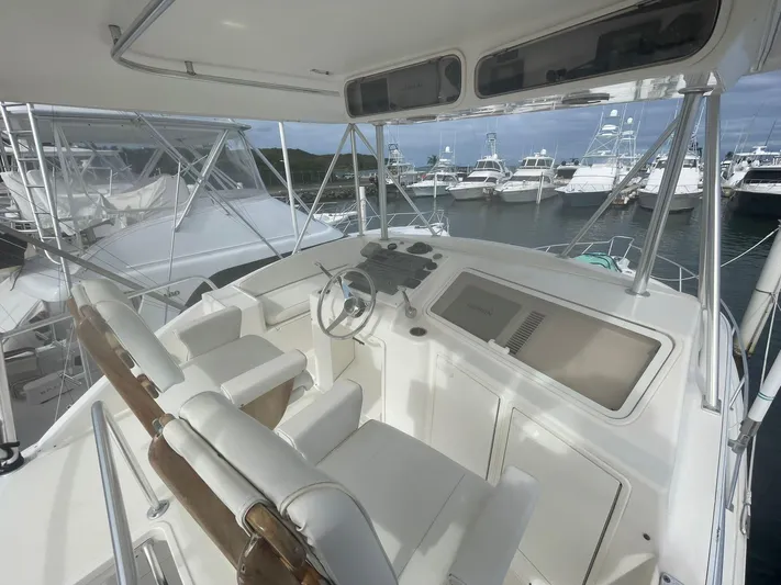  Yacht Photos Pics 2000 Ocean Yachts Convertible helm with dual seats and marina view.