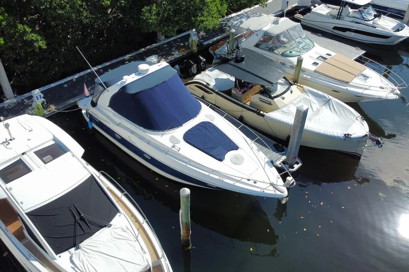  Yacht Photos Pics 2007 Cruisers Yachts 370 Express docked among other boats in a marina.