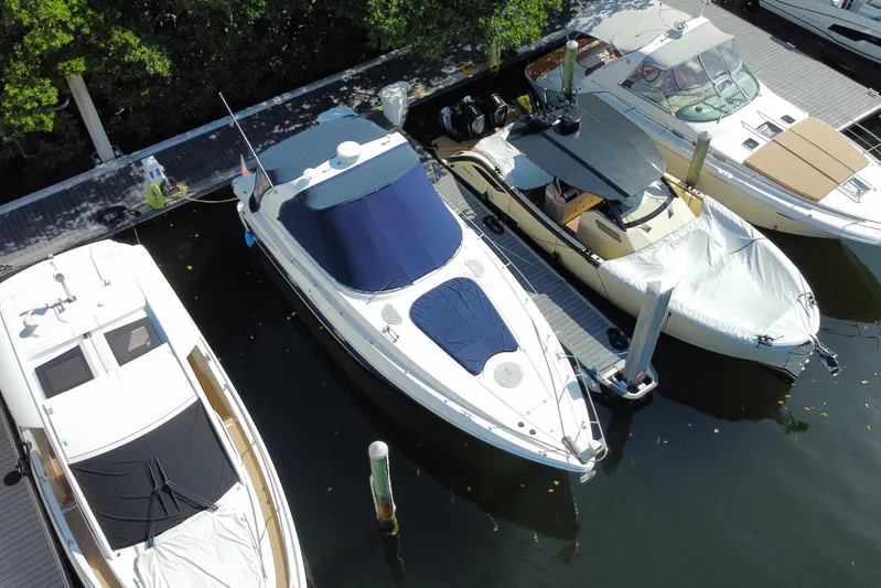  Yacht Photos Pics 2007 Cruisers Yachts 370 Express docked among other boats in a marina.