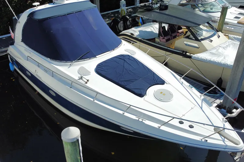  Yacht Photos Pics 2007 Cruisers Yachts 370 Express docked, featuring sleek design and blue covers.