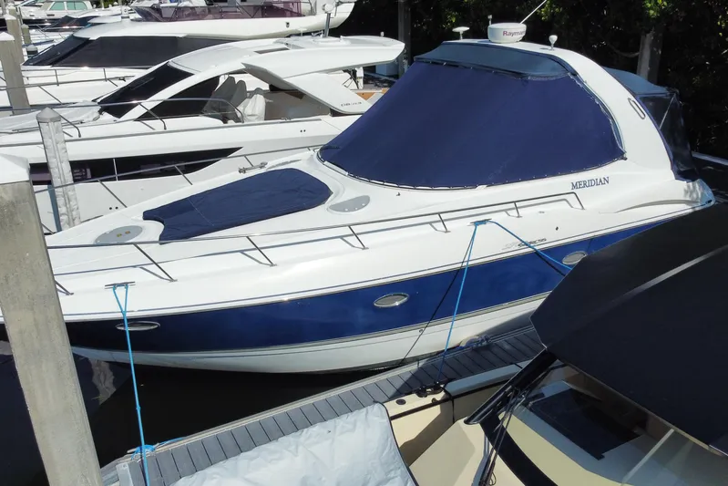  Yacht Photos Pics 2007 Cruisers Yachts 370 Express docked, featuring blue and white design.