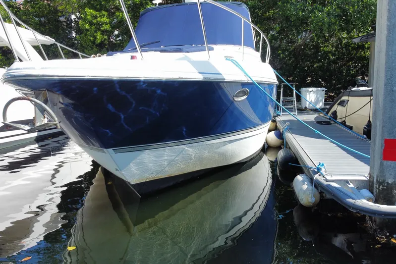  Yacht Photos Pics 2007 Cruisers Yachts 370 Express docked, featuring sleek blue and white design.