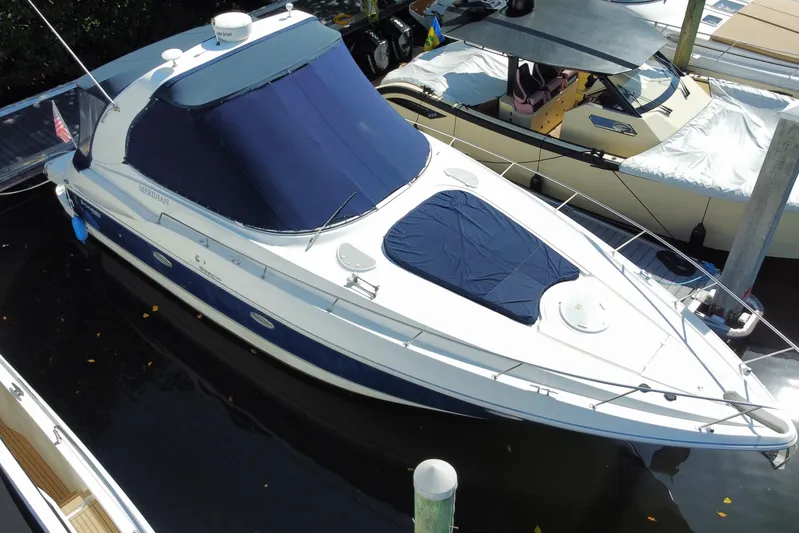  Yacht Photos Pics 2007 Cruisers Yachts 370 Express docked, featuring blue covers and sleek design.