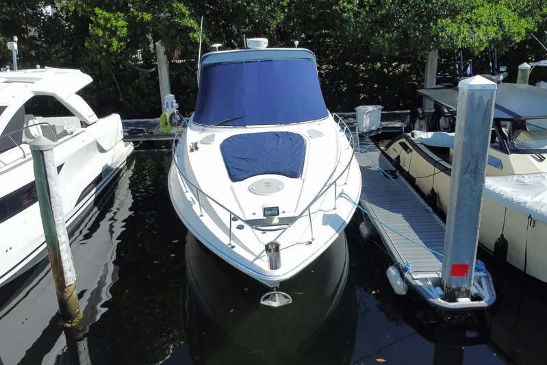  Yacht Photos Pics 2007 Cruisers Yachts 370 Express docked at marina, front view.