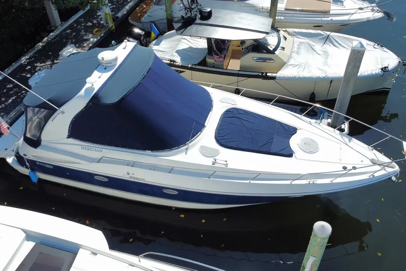  Yacht Photos Pics 2007 Cruisers Yachts 370 Express docked, featuring blue and white design with covered deck.