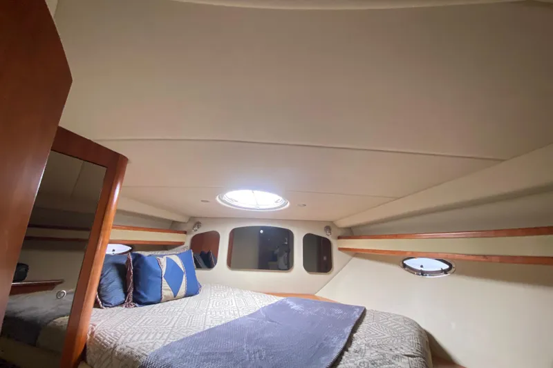  Yacht Photos Pics Luxurious cabin interior of 2007 Cruisers Yachts 370 Express with cozy bedding.