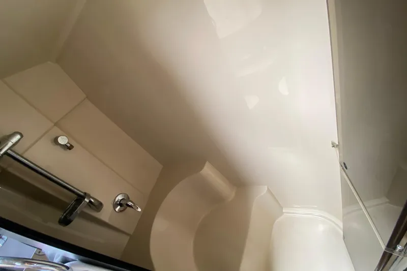  Yacht Photos Pics 2007 Cruisers Yachts 370 Express bathroom interior with sleek fixtures and modern design.