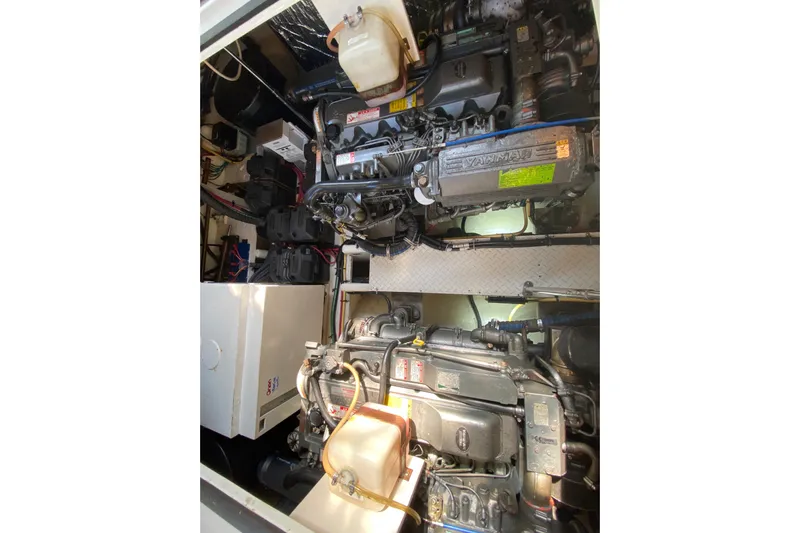  Yacht Photos Pics Engine compartment of 2007 Cruisers Yachts 370 Express, showcasing Yanmar engines and components.