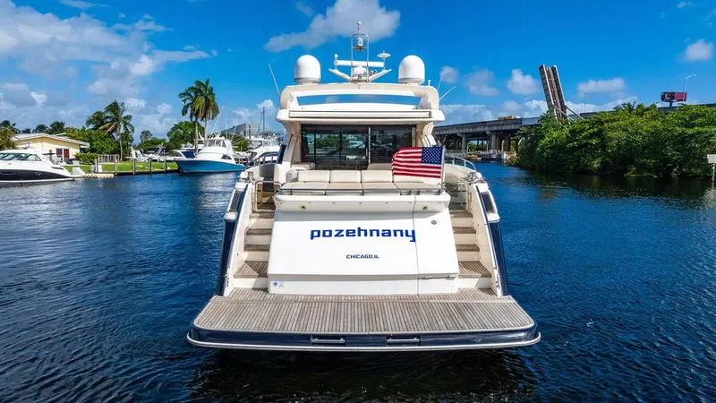  Yacht Photos Pics Luxury 2010 Princess V78 yacht on a scenic waterway with American flag.