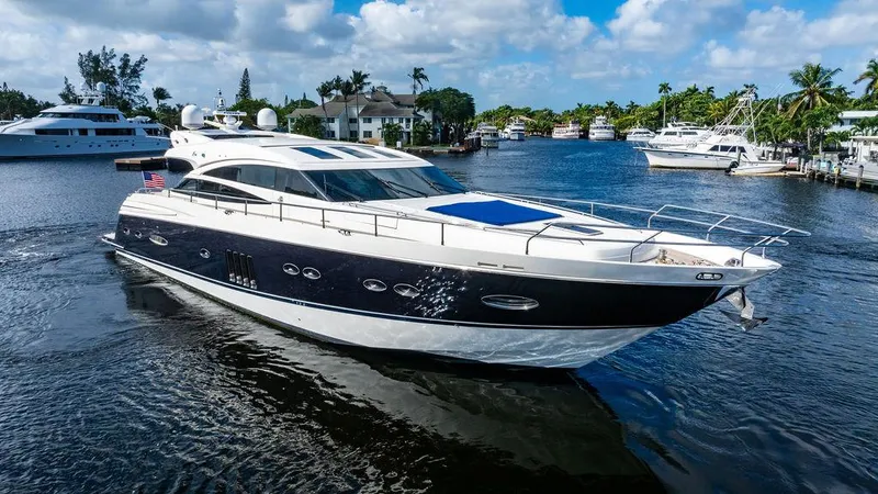  Yacht Photos Pics Luxurious 2010 Princess V78 yacht cruising on a sunny day in a scenic marina.