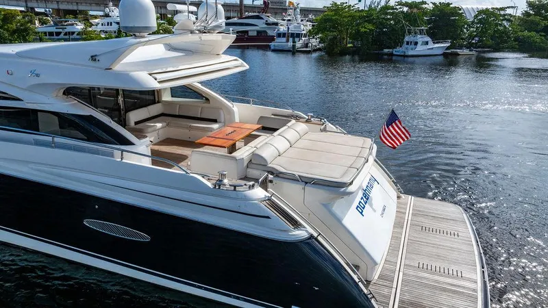  Yacht Photos Pics Luxury 2010 Princess V78 yacht docked, featuring spacious deck and American flag.