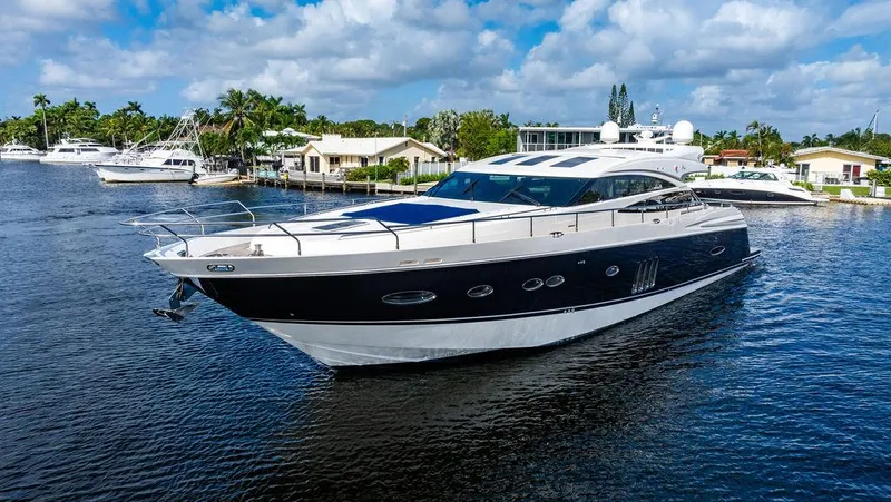  Yacht Photos Pics Luxurious 2010 Princess V78 yacht cruising on a serene waterway.