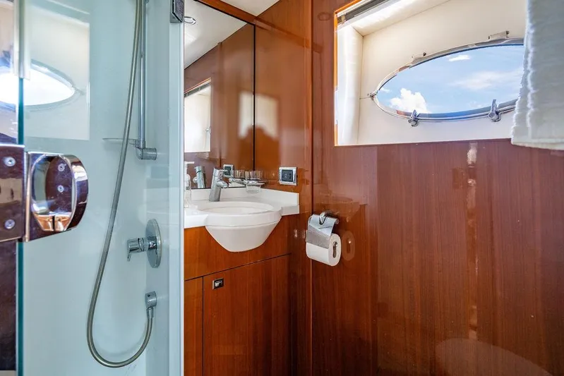  Yacht Photos Pics Luxurious bathroom in 2010 Princess V78 yacht with wood paneling and modern fixtures.