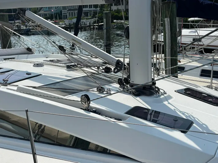 Hallucination Yacht Photos Pics Sailboat deck of 2012 Bavaria Vision 46, featuring rigging and hatches at a marina.