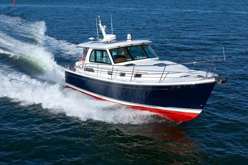  Yacht Photos Pics 2022 Sabre 38 SE boat cruising on open water, showcasing sleek design and performance.