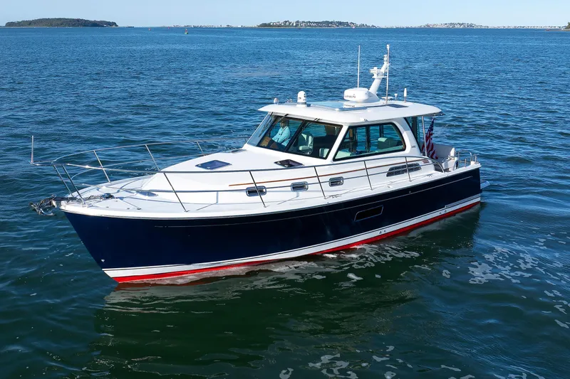  Yacht Photos Pics 2022 Sabre 38 SE yacht cruising on open water, showcasing sleek design and elegance.