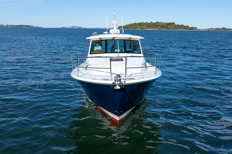 Yacht Photos Pics 2022 Sabre 38 SE yacht on open water, front view with clear blue sky.