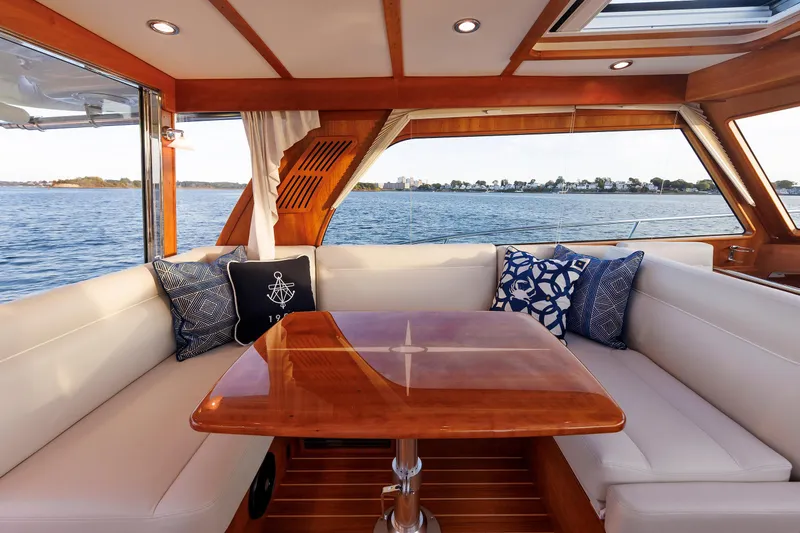 Yacht Photos Pics Luxurious interior of 2022 Sabre 38 SE yacht with elegant seating and scenic water view.