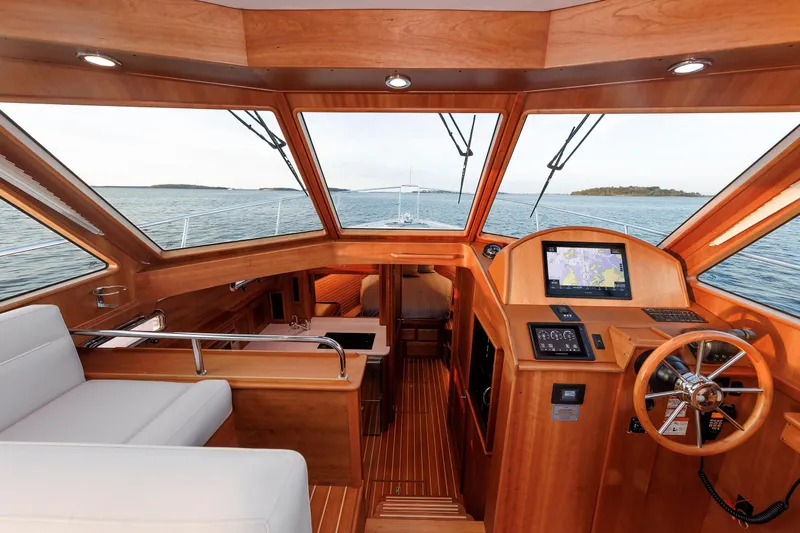  Yacht Photos Pics Interior view of 2022 Sabre 38 SE yacht with wooden finish and navigation system.