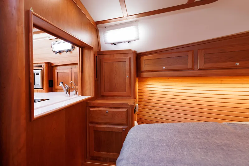  Yacht Photos Pics Interior of 2022 Sabre 38 SE yacht, featuring elegant wood cabinetry and modern fixtures.