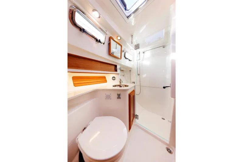  Yacht Photos Pics 2022 Sabre 38 SE yacht bathroom with modern fixtures and sleek design.