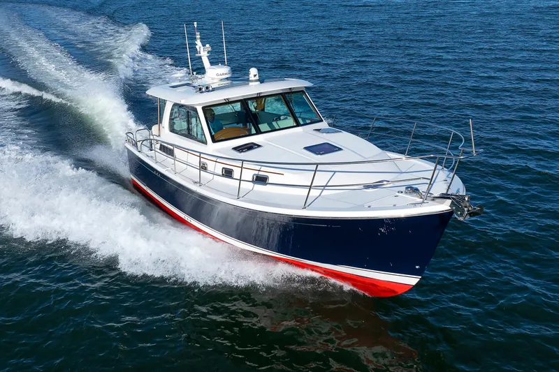  Yacht Photos Pics 2022 Sabre 38 SE yacht cruising on open water, showcasing sleek design and performance.