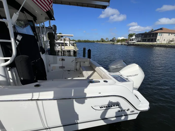  Yacht Photos Pics 2023 Boston Whaler 325 Conquest boat on water with Mercury engines.