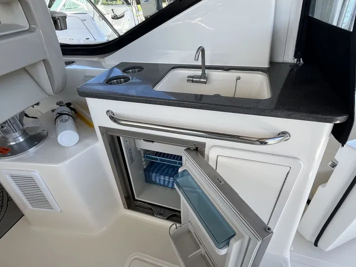  Yacht Photos Pics Boston Whaler 325 Conquest 2023 with sink and refrigerator.