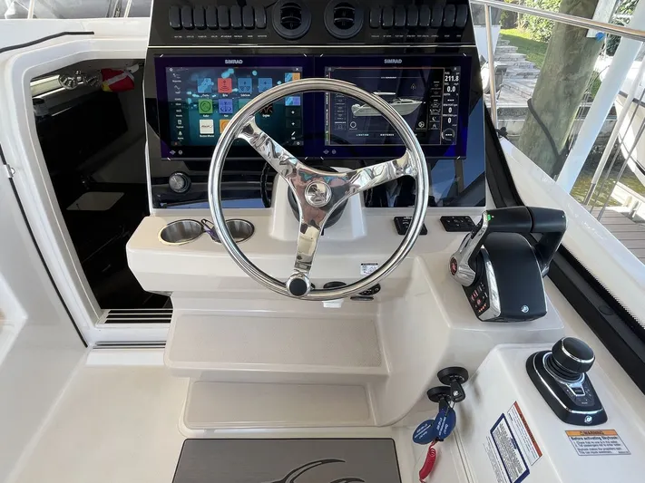  Yacht Photos Pics Helm of 2023 Boston Whaler 325 Conquest with modern electronics.