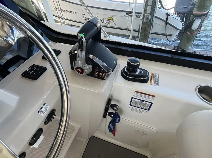  Yacht Photos Pics 2023 Boston Whaler 325 Conquest helm with controls and steering wheel.