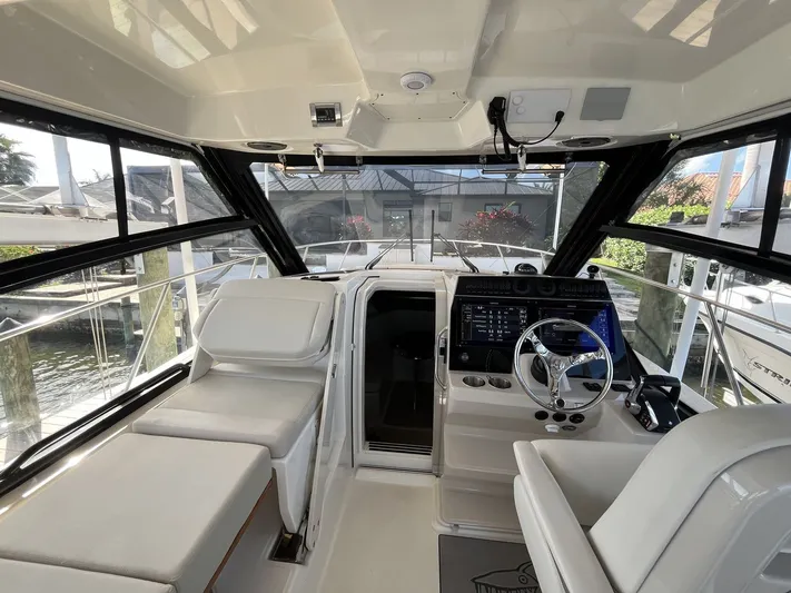  Yacht Photos Pics Interior of 2023 Boston Whaler 325 Conquest with modern helm console.