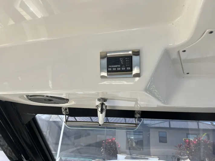  Yacht Photos Pics Interior view of 2023 Boston Whaler 325 Conquest with Dometic control panel.