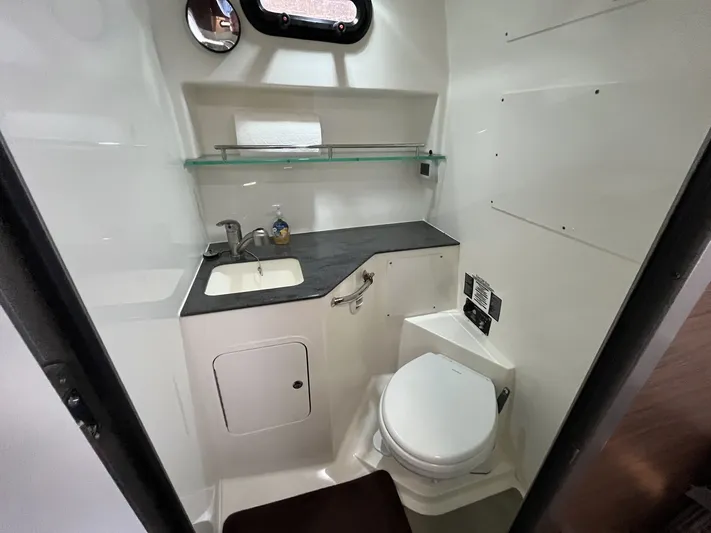  Yacht Photos Pics Interior of 2023 Boston Whaler 325 Conquest with toilet and sink.