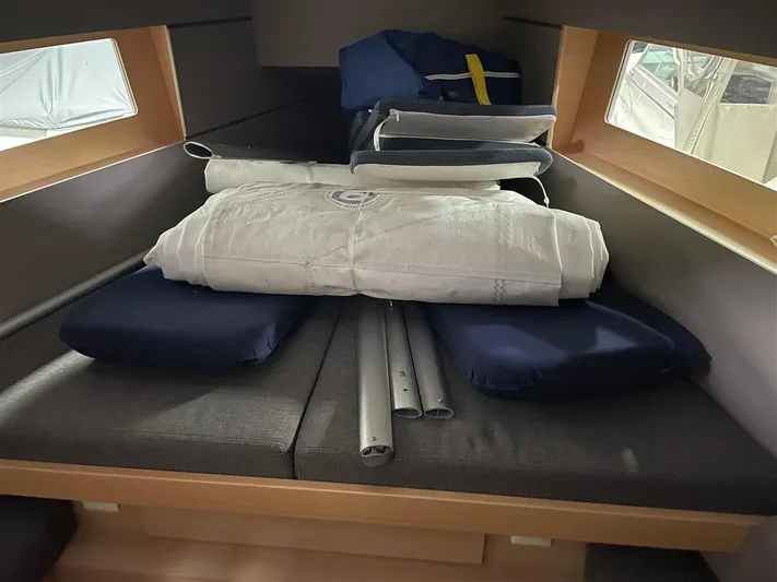 Rock Chalk Yacht Photos Pics Forward Cabin Berth with Sails and Cockpit Cushions