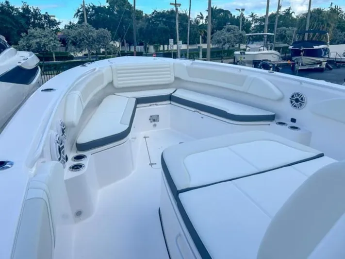  Yacht Photos Pics 2025 Edgewater 340CC boat interior with white seating and cup holders.