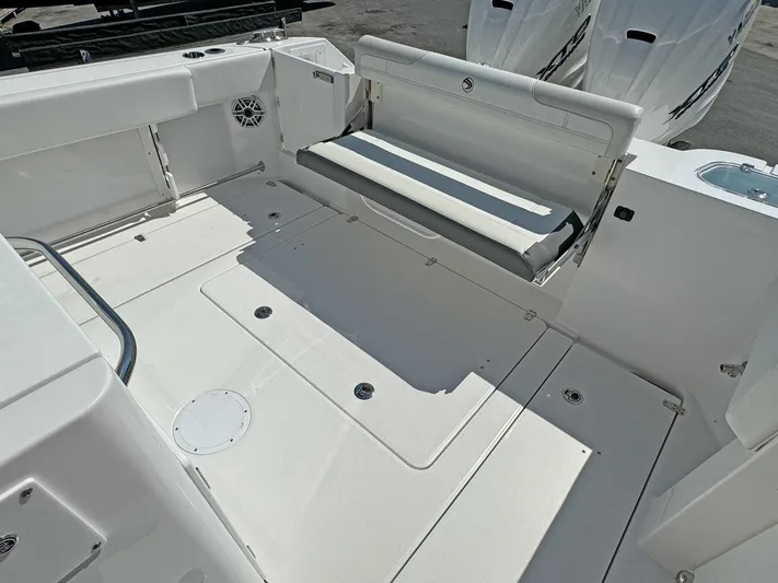  Yacht Photos Pics 2025 Edgewater 340CC boat deck with foldable seating and twin engines.