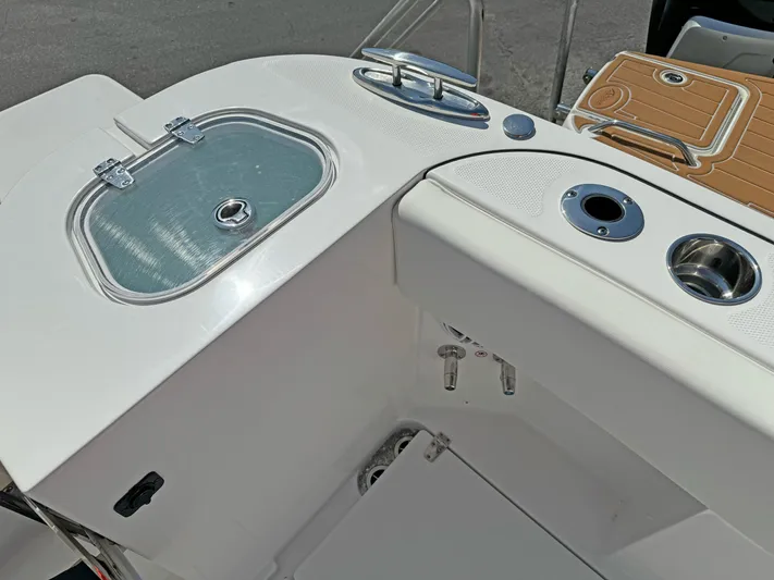  Yacht Photos Pics 2025 Edgewater 340CC boat deck with storage and cup holders.